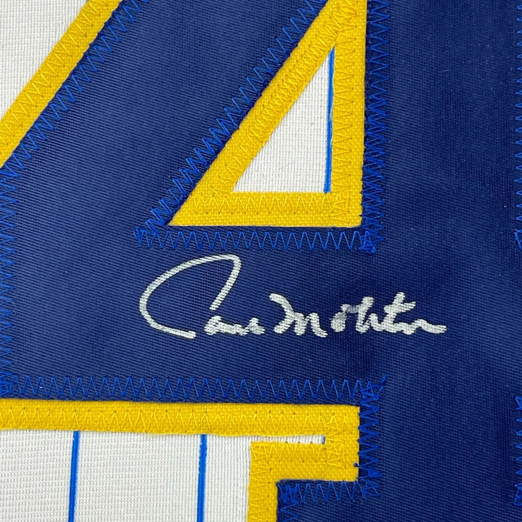 Autographed Paul Molitor Brewers jersey in blue and yellow with number 4 and framed photos