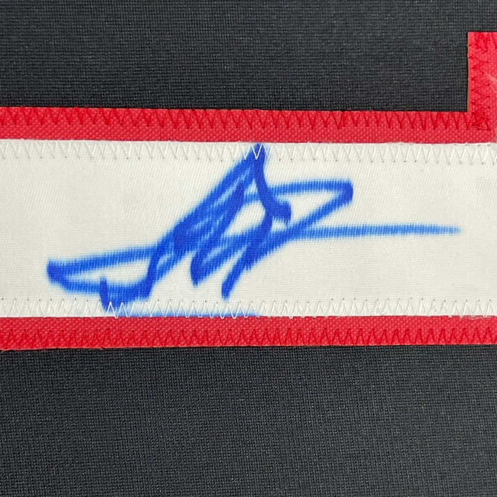 Blue autograph on white and red Yan Fighter Jersey in a 35x39 frame ready to hang