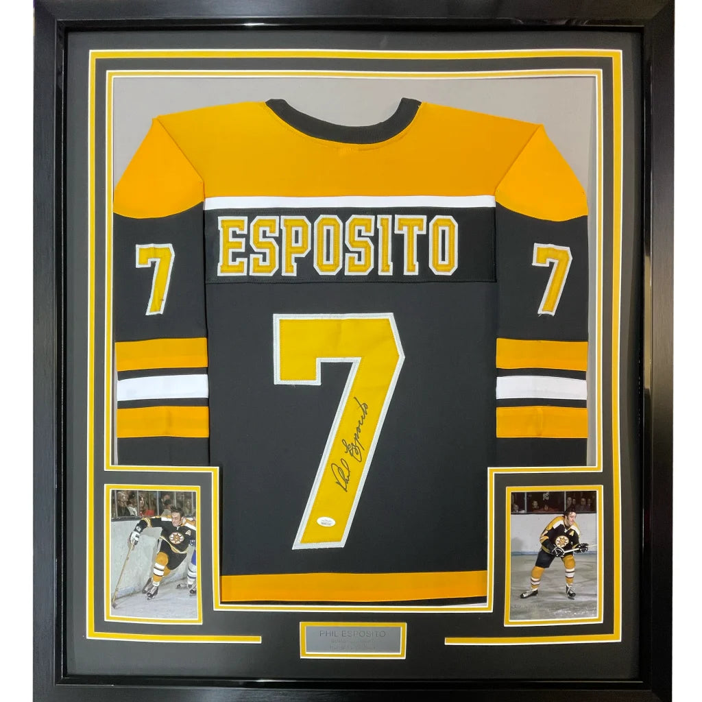Framed autographed black and gold Boston Bruins hockey jersey with Esposito name and number 7 in black case