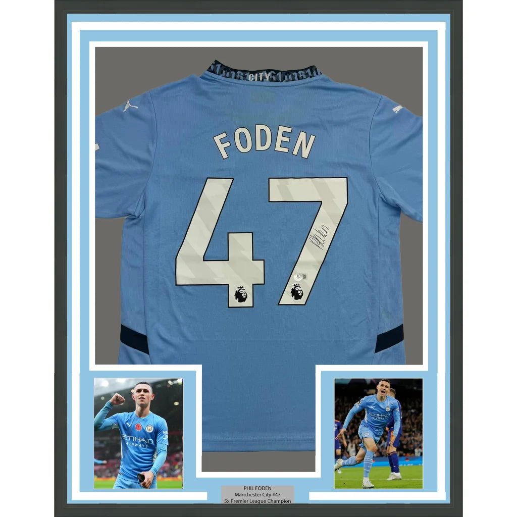 Framed signed Manchester City light blue jersey with player photos ready to display