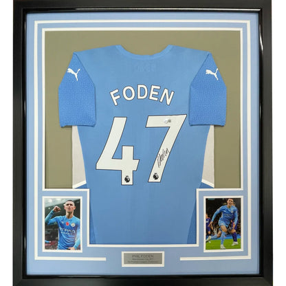 Framed light blue soccer jersey with Foden 47 on the back ready to hang display