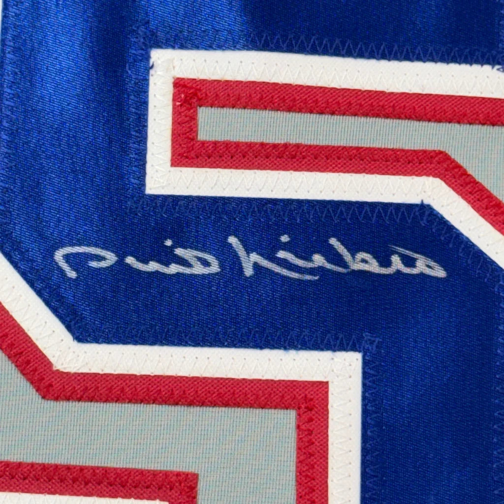 Blue sports jersey with white, red, gray numbers and a white signature, collectible