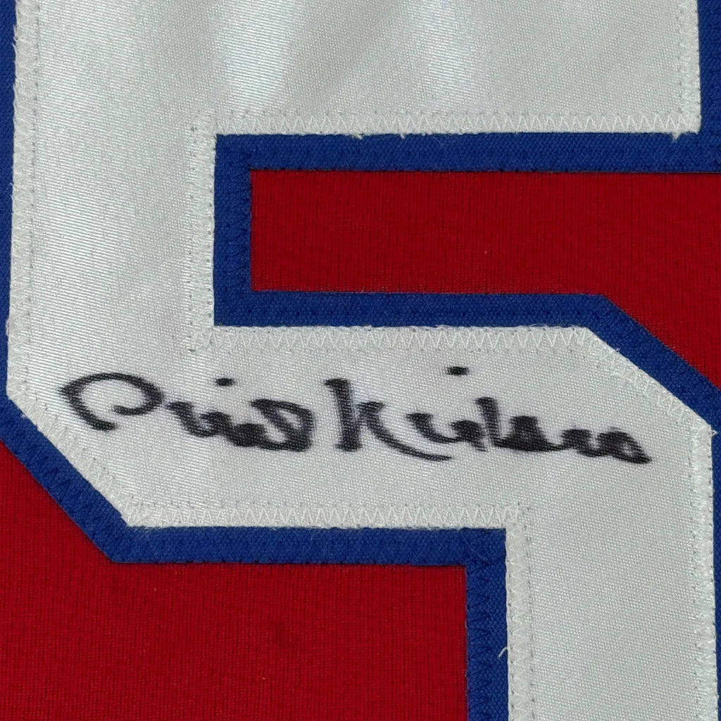Framed autographed Phil Niekro Atlanta Braves jersey back with white red blue number patch and black signature