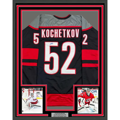 Framed Autographed Pyotr Kochetkov 35x39 Carolina Black Hockey Jersey JSA COA | Hall of Fame Sports Memorabilia | vintageantiquesgifts.com