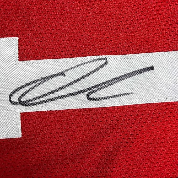 Framed autographed ohio state red mesh football jersey with black ink signature on white stripe