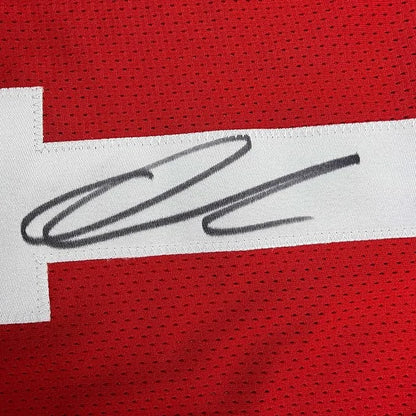 Framed autographed ohio state red mesh football jersey with black ink signature on white stripe