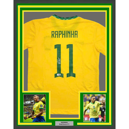 Framed autographed brazil yellow soccer jersey with green trim raphinha name and number 11 signed by raphael belloli
