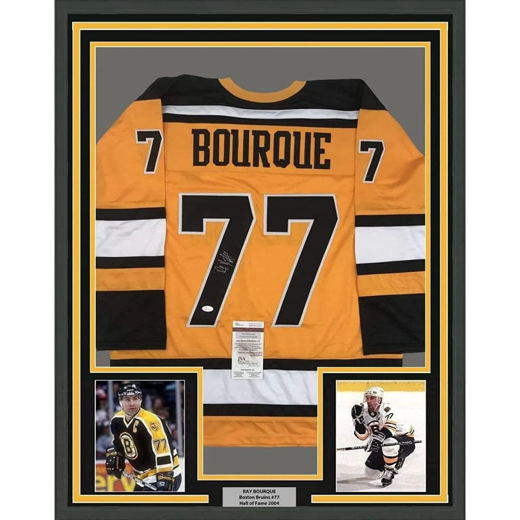 Framed Ray Bourque signed Boston Bruins yellow hockey jersey with player photos and JSA COA