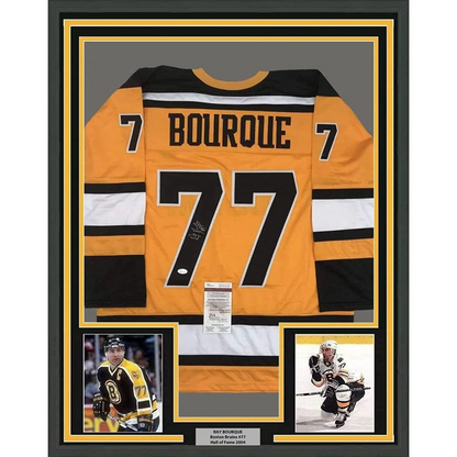 Framed Ray Bourque signed Boston Bruins yellow hockey jersey with player photos and JSA COA