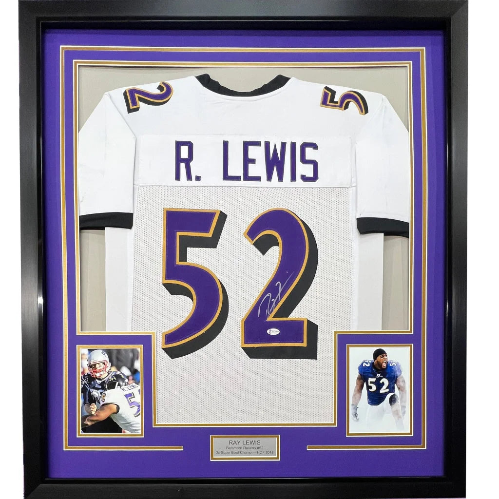 Framed Ray Lewis Autographed Ravens Jersey with Player Photos on display