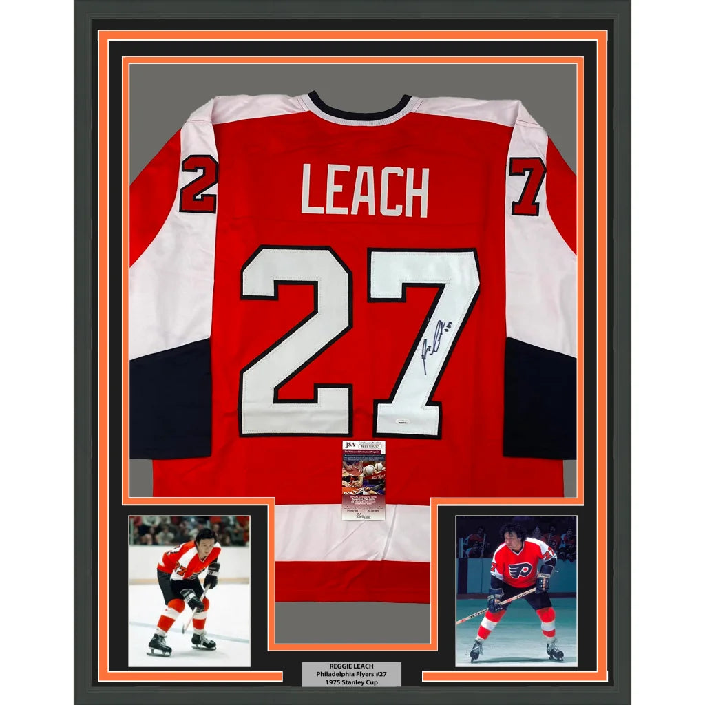 Framed autographed Reggie Leach Philadelphia Flyers orange jersey, number 27