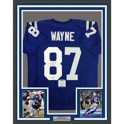 Back of a framed autographed blue indianapolis colts football jersey with white number 87 wayne and signature