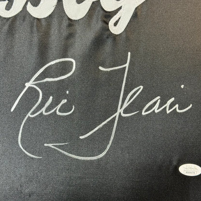 Black fabric with white embroidered signature from Ultimate Man Cave Ric Flair robe display