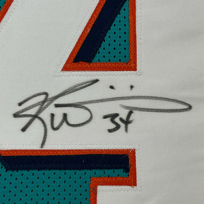 Framed autographed Ricky Williams Miami Dolphins teal jersey number 34 with JSA COA