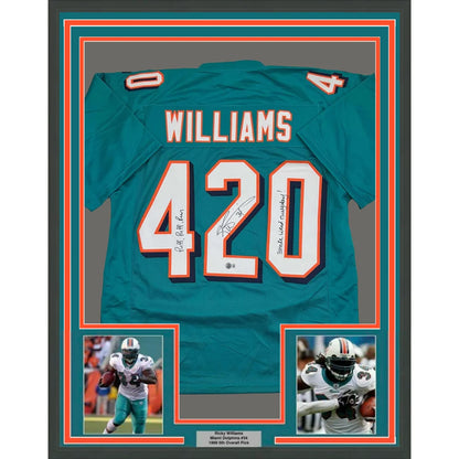 Framed signed Ricky Williams #420 inscribed Miami Dolphins teal jersey back