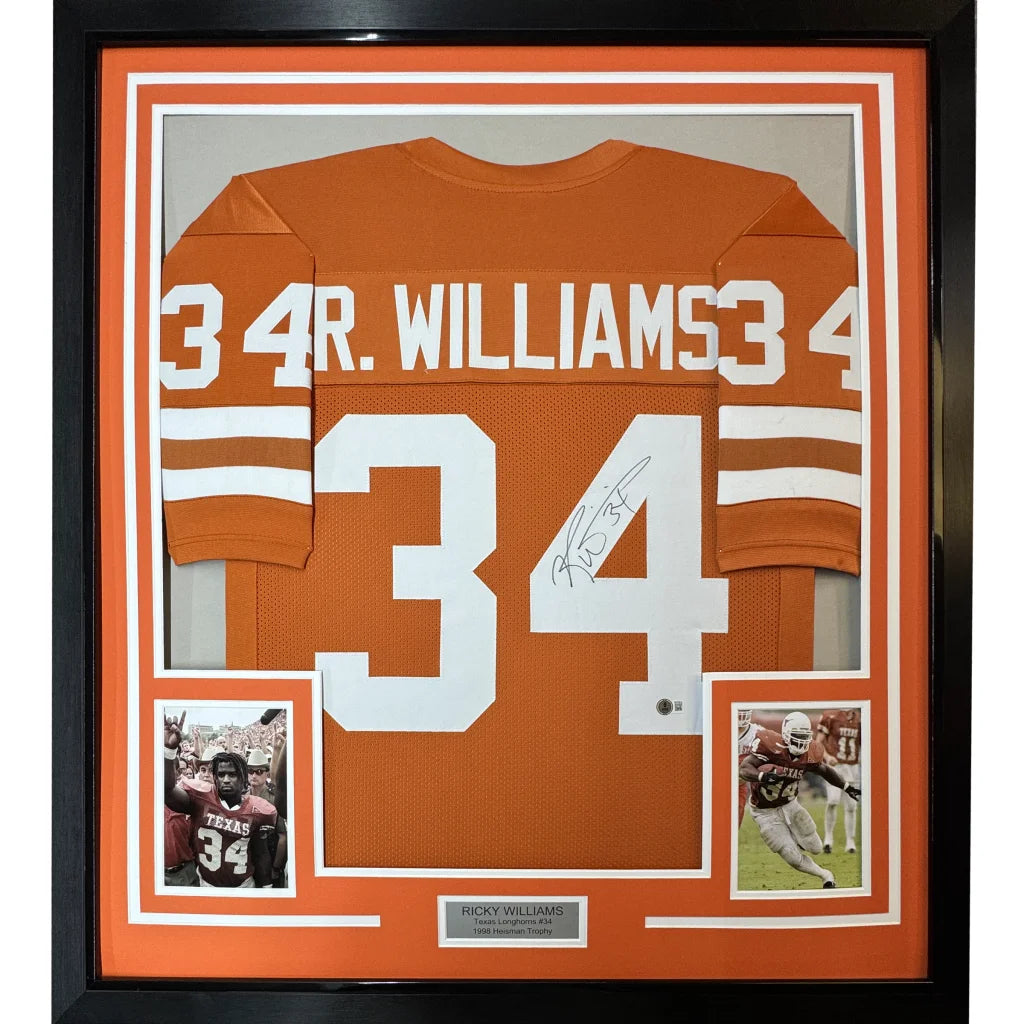 Framed autographed burnt orange football jersey with player photos and nameplate