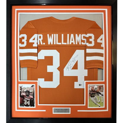 Framed autographed burnt orange football jersey with player photos and nameplate