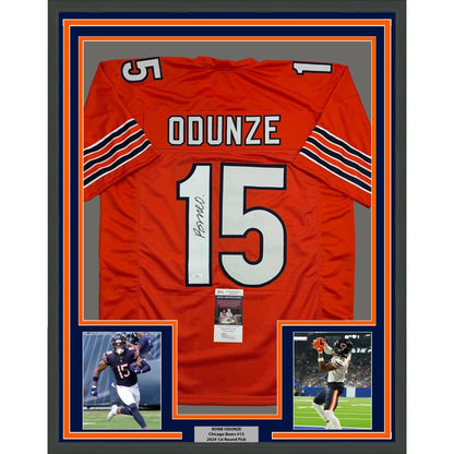 Autographed orange football jersey with photos and plaque in a framed display
