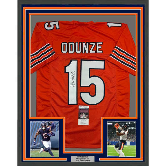 Autographed orange football jersey with photos and plaque in a framed display