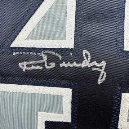Autographed navy blue athletic jersey with light blue and white numbers, professionally framed