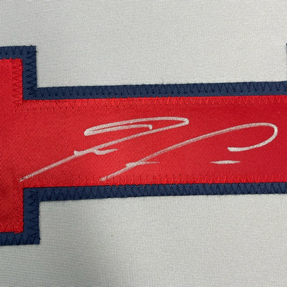 Framed autographed Ronald Acuna Jr. Atlanta Braves jersey with red and navy embroidered patch