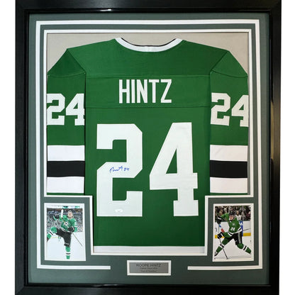 Framed signed green hockey jersey with player photos ready to hang on your wall