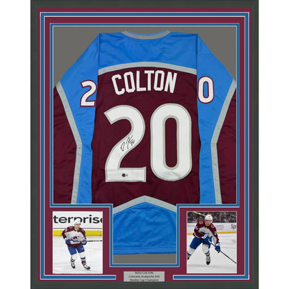 Framed signed burgundy and blue hockey jersey with player photos ready to hang
