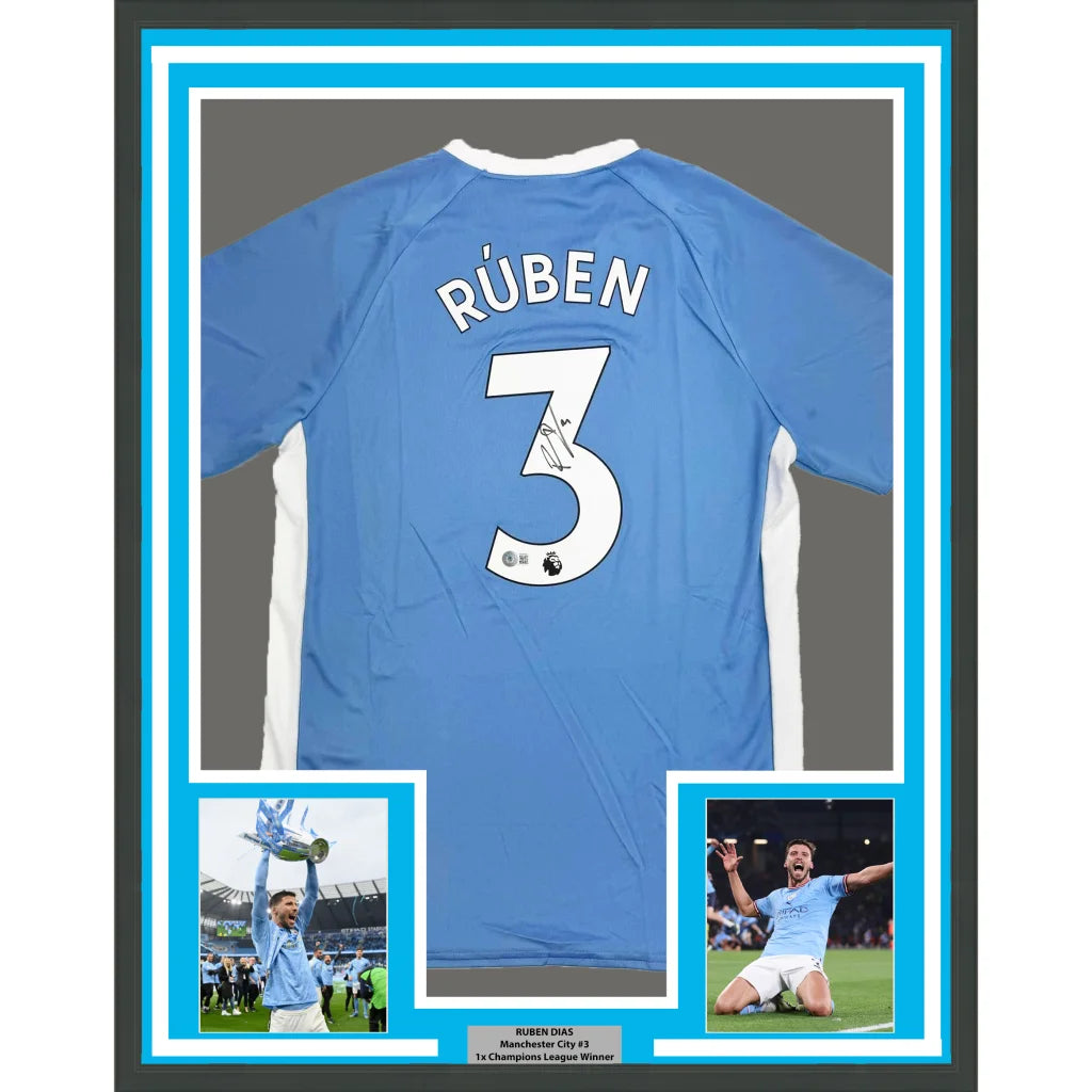 Framed Autographed Ruben Dias 35x39 Manchester City Blue Soccer Futbol Jersey Beckett BAS COA #2 | Hall of Fame Sports Memorabilia | vintageantiquesgifts.com