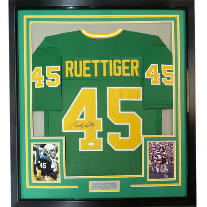 Professionally framed Notre Dame Rudy Ruettiger signed football jersey with autographs and photos