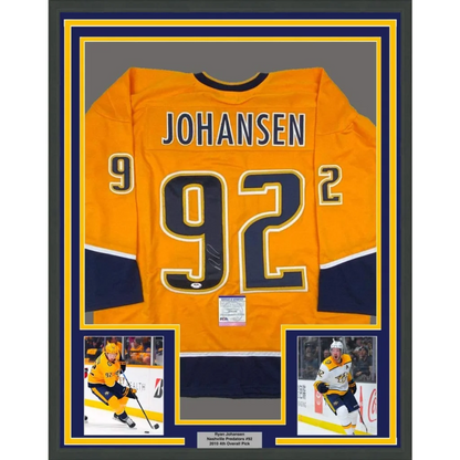 Vibrant orange nashville predators hockey jersey with navy blue gold accents and johansen 92 on back framed autographed