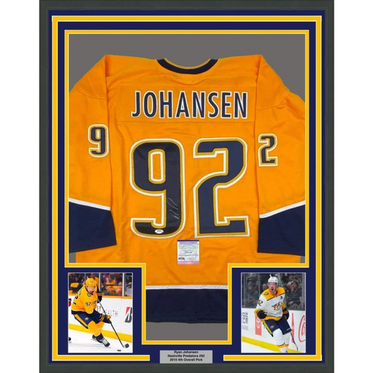 Vibrant orange nashville predators hockey jersey with navy blue gold accents and johansen 92 on back framed autographed