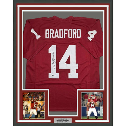 Framed Autographed Sam Bradford 35x39 Oklahoma Red College Football Jersey Beckett BAS COA | Hall of Fame Sports Memorabilia | vintageantiquesgifts.com