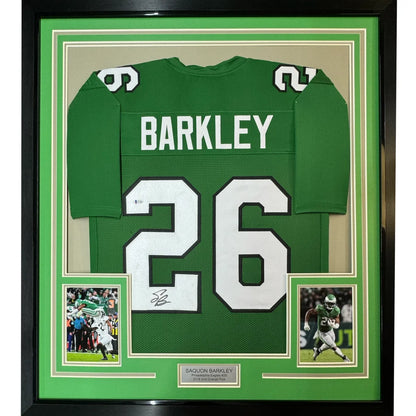 Framed Saquon Barkley Philadelphia Eagles #26 signed jersey with photos on display