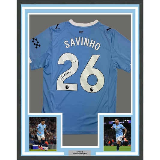 Framed Autographed Savinho 35x39 Manchester City Blue Soccer Futbol Jersey Beckett BAS COA | Hall of Fame Sports Memorabilia | vintageantiquesgifts.com