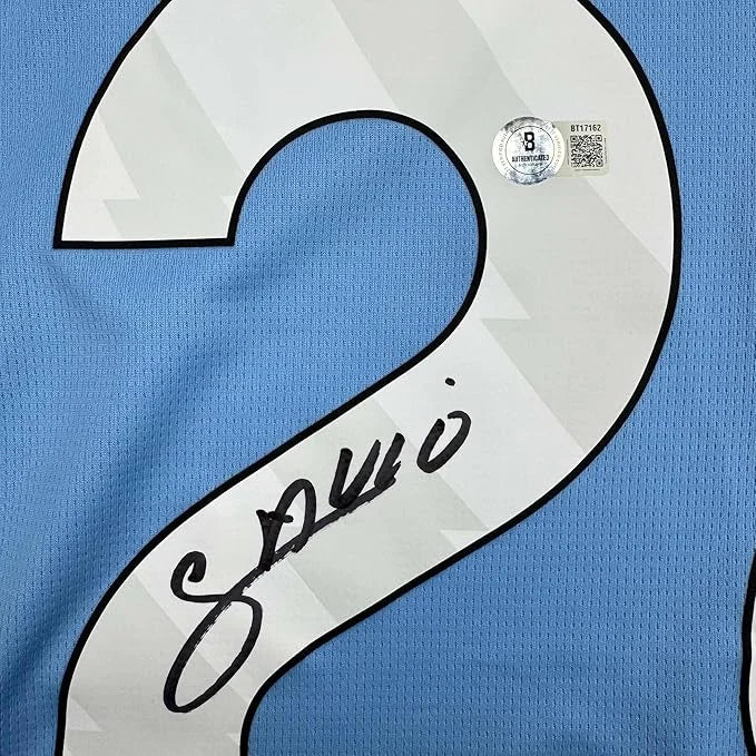 Framed autographed Savinho Manchester City light blue soccer jersey back with number 2, Beckett BAS COA