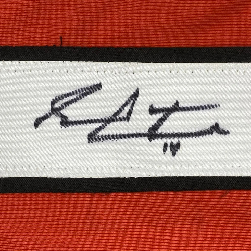 White woven label with Sean Couturier signed heart on red-bordered jersey