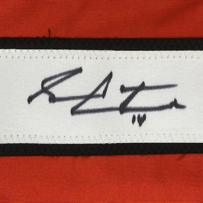 White woven label with Sean Couturier signed heart on red-bordered jersey