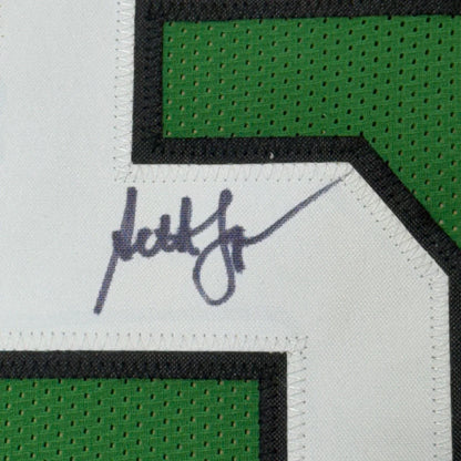Autographed green and white Seth Joyner jersey perfect for your man cave display