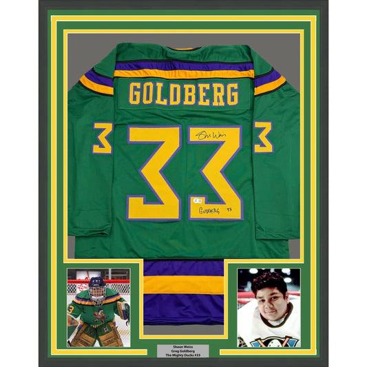 Framed Autographed Shaun Weiss Greg Goldberg 35x39 The Mighty Ducks Green Hockey Jersey Beckett BAS COA | Hall of Fame Sports Memorabilia | vintageantiquesgifts.com