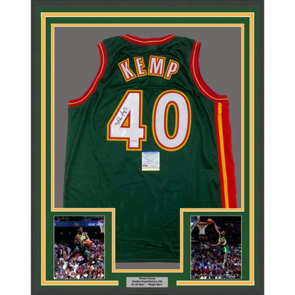 Professionally framed Shawn Kemp autographed Sonics jersey with player photos and plaque