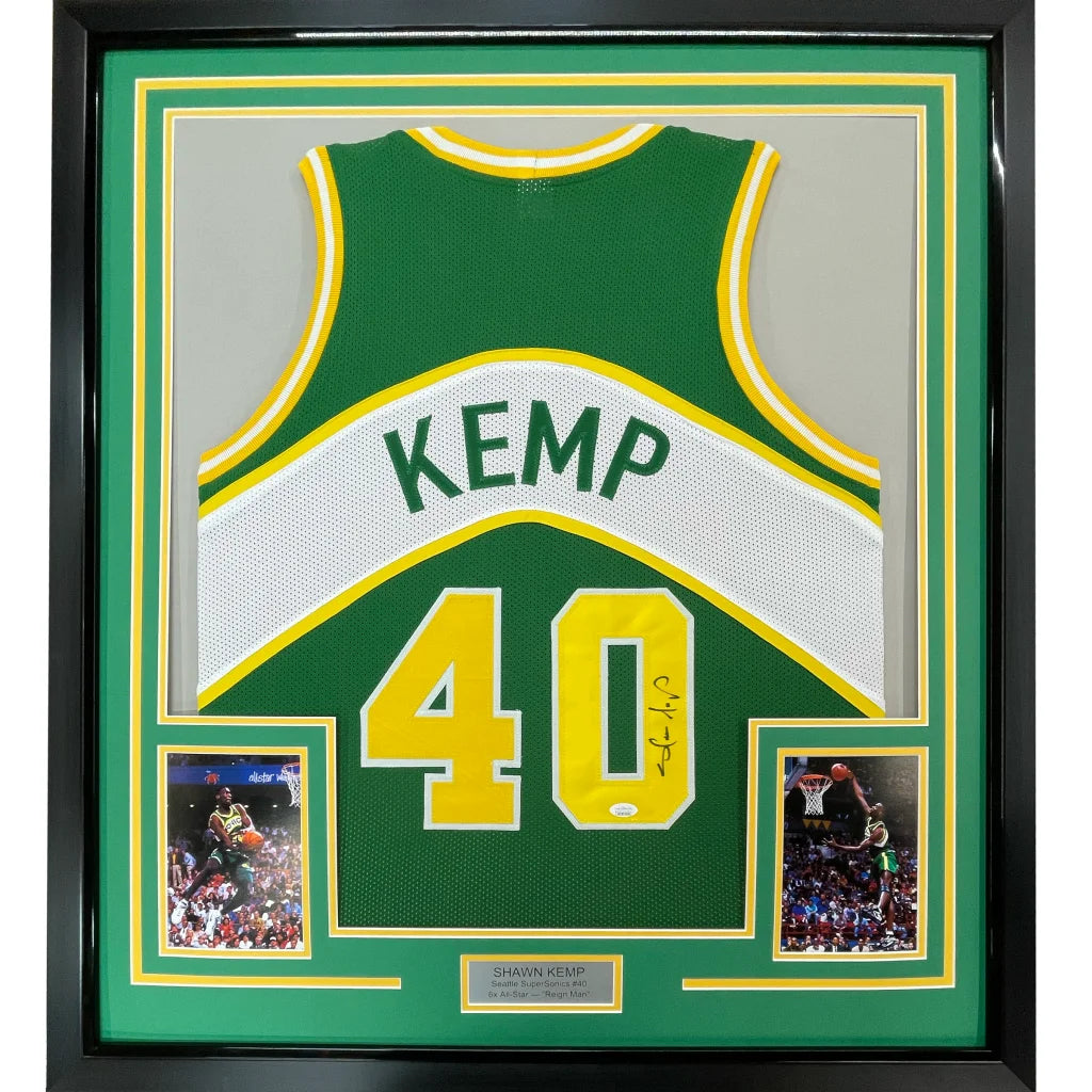 Framed Shawn Kemp Seattle SuperSonics autographed jersey with photos on display