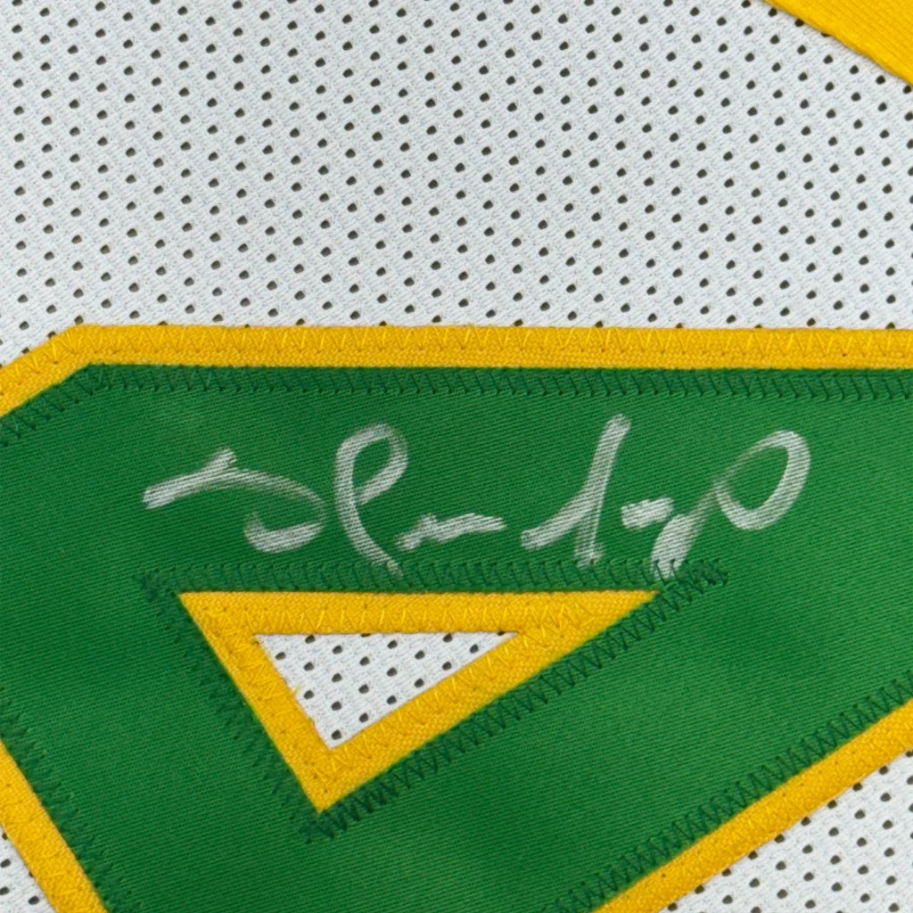 White Shawn Kemp basketball jersey with green yellow trim, professionally framed autograph