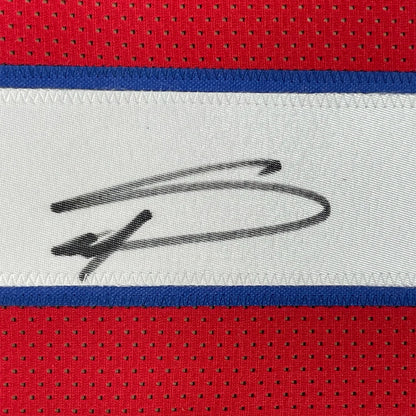 Red Buffalo Bills jersey with black autograph on white stripe, ready to display