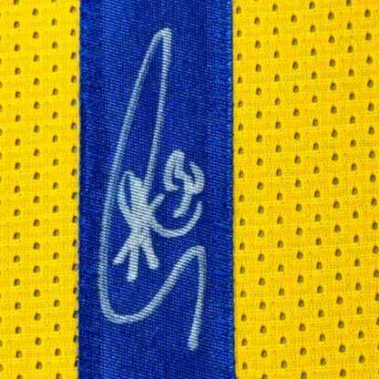Blue and yellow mesh fabric with white signature on professionally framed Golden State Warriors item