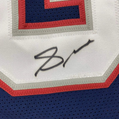 Autographed Patriots jersey in white red and blue ready to display with photos