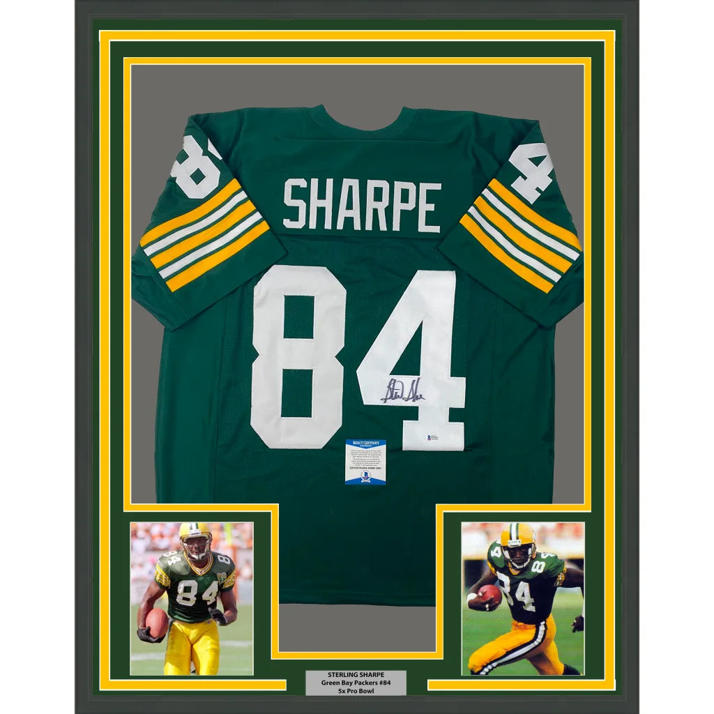 Back side of framed autographed green and yellow green bay packers sterling sharpe jersey with white number 84 and signature