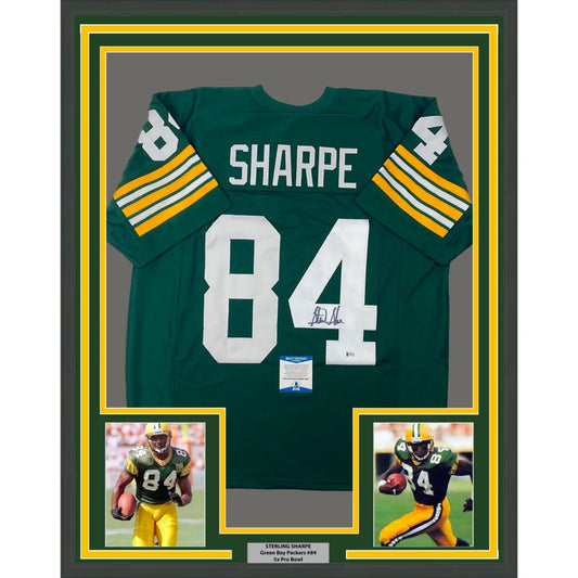 Back side of framed autographed green and yellow green bay packers sterling sharpe jersey with white number 84 and signature