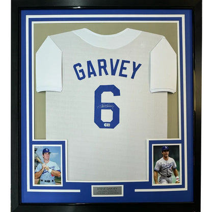Framed Autographed Steve Garvey 35x39 Los Angeles LA White Baseball Jersey Beckett BAS COA | Hall of Fame Sports Memorabilia | vintageantiquesgifts.com