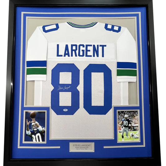 Framed autographed Steve Largent Seattle Seahawks white jersey with green stripes PSA/DNA COA