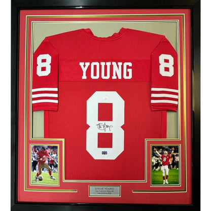 Framed Steve Young signed San Francisco 49ers jersey with player photos for display